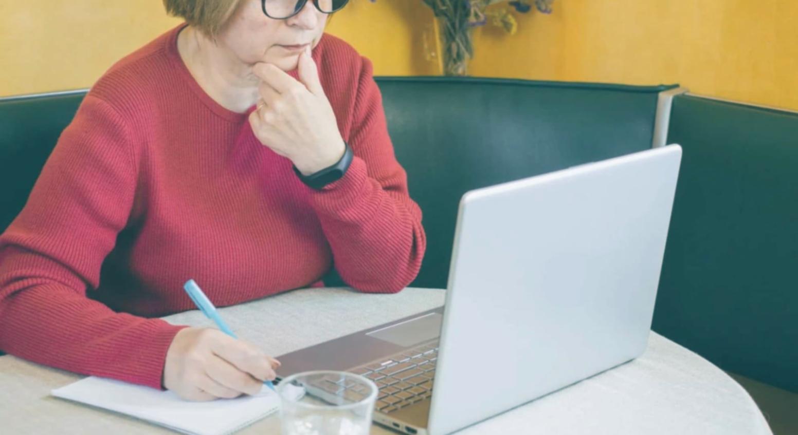 Instructor reviewing financial models and valuation spreadsheets before a live webinar